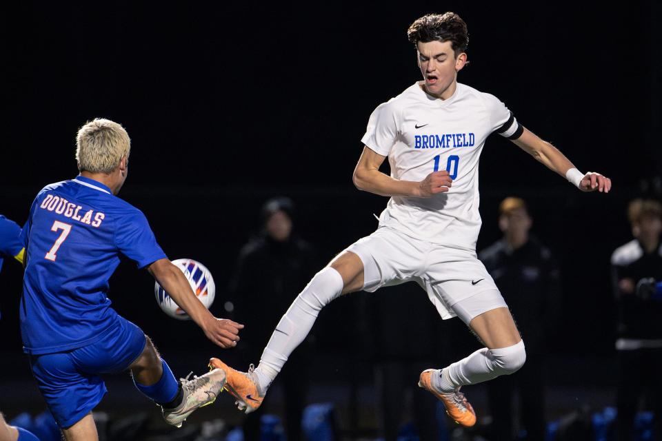 Bromfield's Brendan Listzwan and Douglas's Lucas Teixeira leap for the ball during a MIAA D5 state semifinal on Wednesday November 15, 2023 in Ayer.