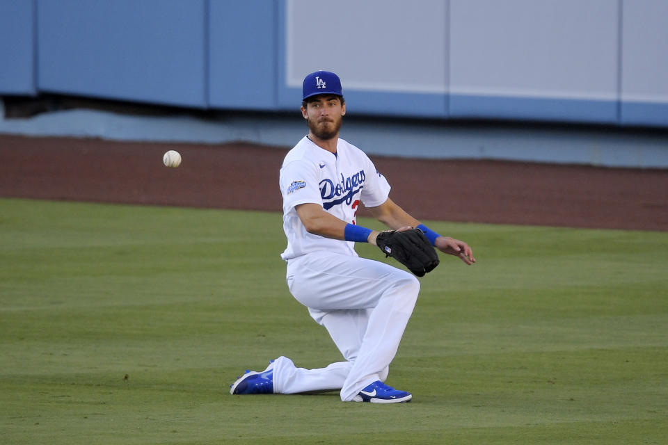 Los Angeles Dodgers' Cody Bellinger misjudges a ball hit for a double by Anthony Garcia during an intrasquad baseball game Wednesday, July 15, 2020, in Los Angeles. (AP Photo/Mark J. Terrill)