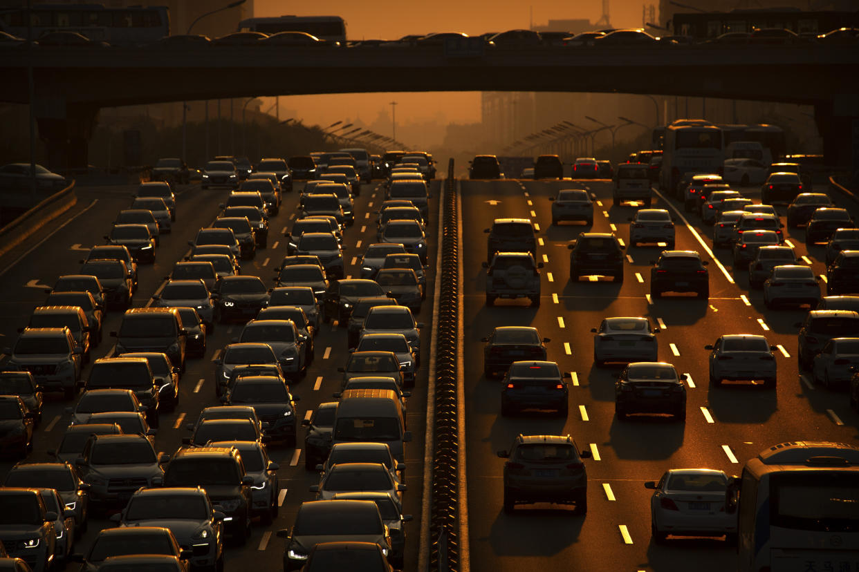 Commuters make their way along an expressway during rush hour in Beijing, Friday, Sept. 6, 2019. According to Chinese state media, the average concentration of PM2.5 fine air pollutants in Beijing in August was at the lowest level ever recorded for that month. (AP Photo/Mark Schiefelbein)