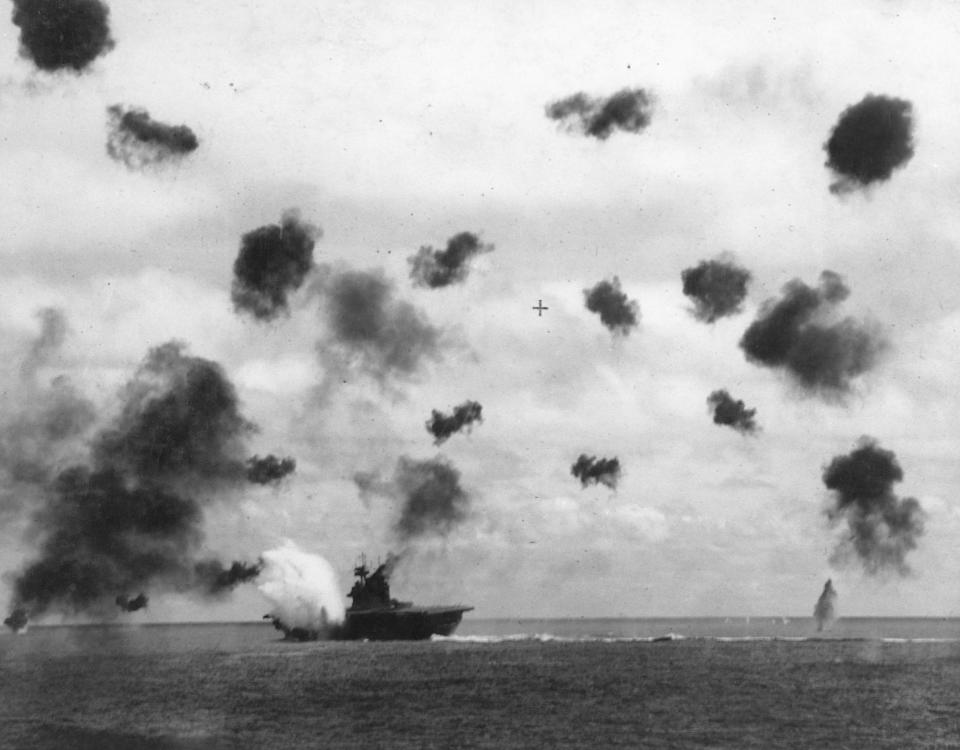 The American aircraft carrier USS Yorktown takes a hit while being bombed in the Battle of Midway, June 1942. / Credit: CORBIS/Corbis via Getty Images