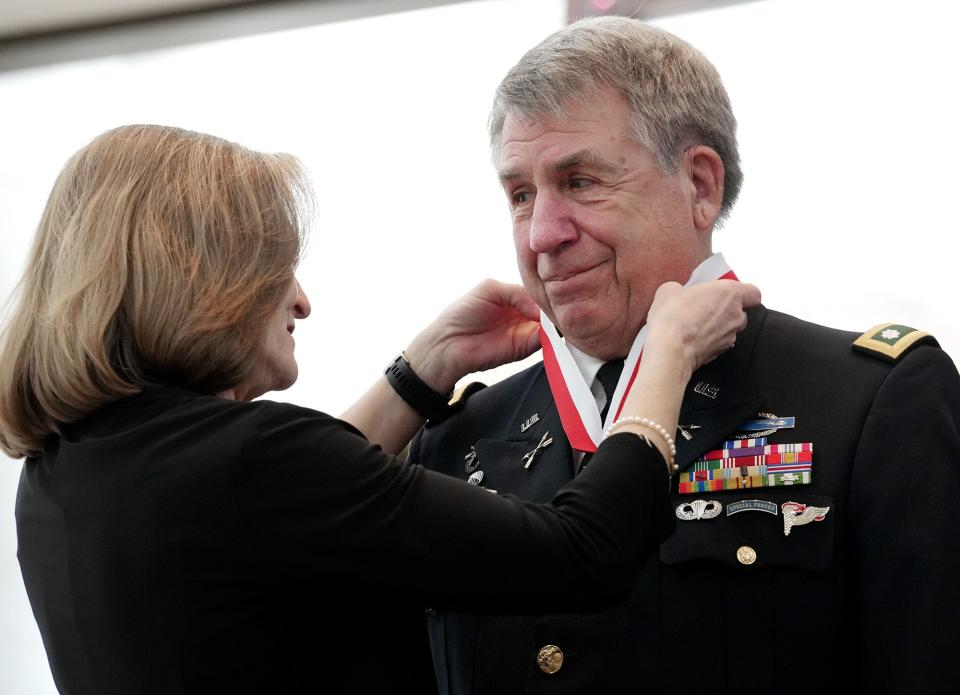 U.S. Army 2nd Lt. Lawrence D. Sadler, right, receives his award at the 2022 induction ceremony for the Ohio Military Hall of Fame for Valor on Friday at the Ohio Statehouse.