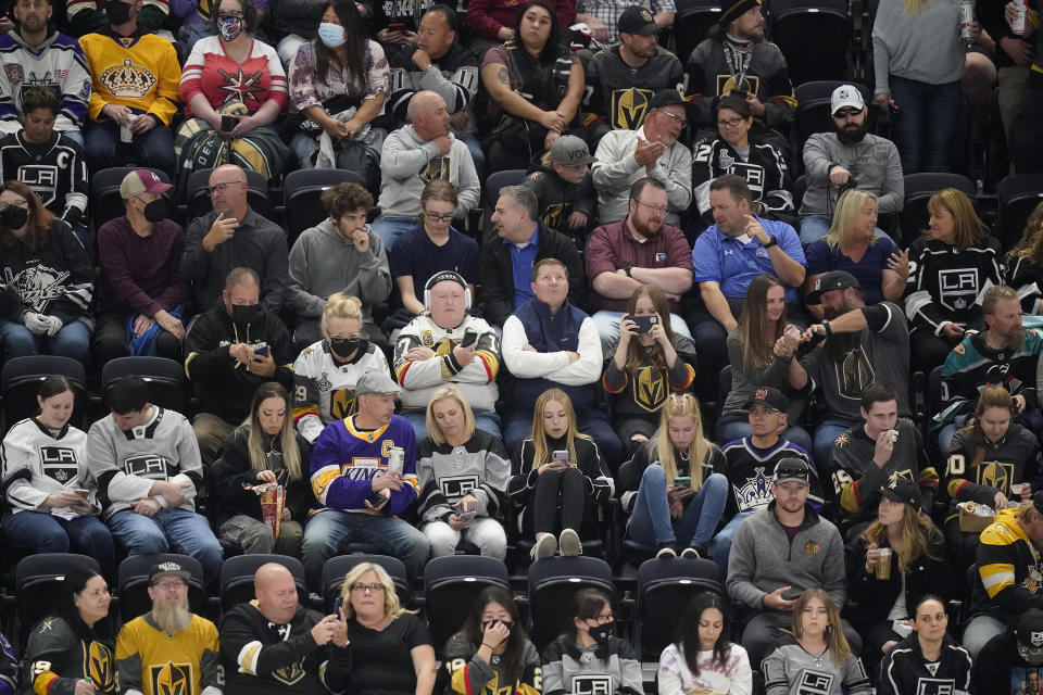Fans occupy their seats before an NHL hockey preseason game between the Vegas Golden Knights and the Los Angeles Kings, Sept. 30, 2021, in Salt Lake City. Hockey has started to take off locally since Salt Lake City began hosting Frozen Fury, an NHL preseason exhibition game, in 2021. (AP Photo/Rick Bowmer)