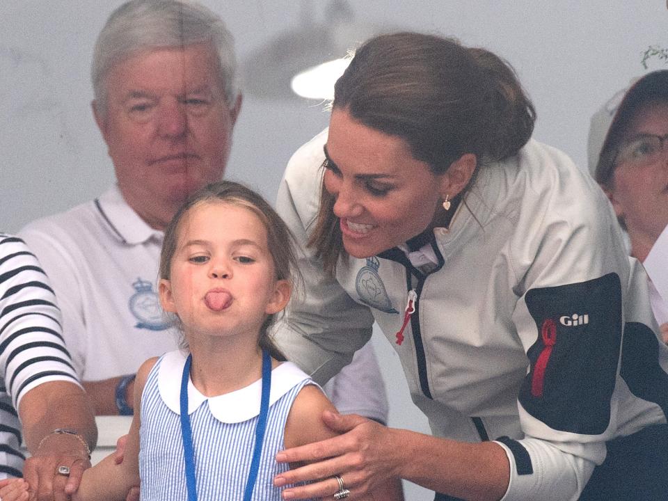 Princess Charlotte sticks out her tongue