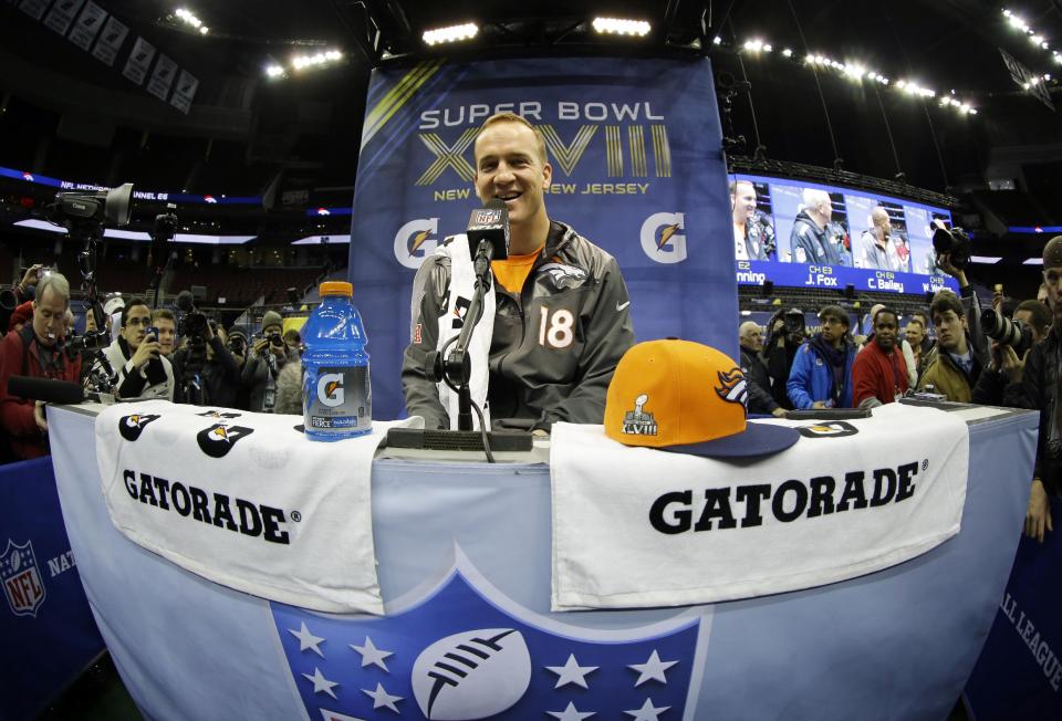 Denver Broncos' Peyton Manning answers questions during media day for the NFL Super Bowl XLVIII football game Tuesday, Jan. 28, 2014, in Newark, N.J. (AP Photo/Matt Slocum)