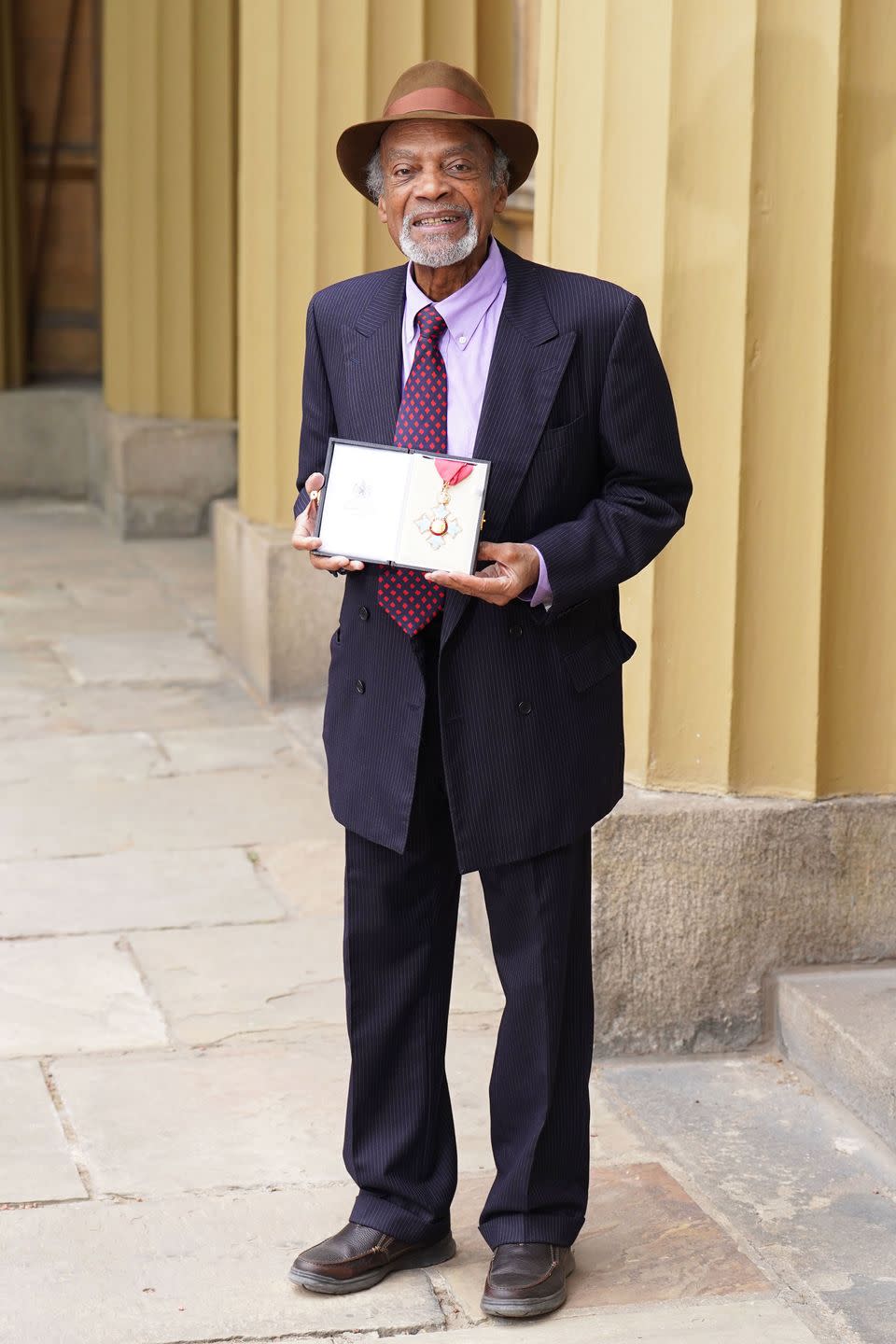 ram john holder with his cbe in may 2022