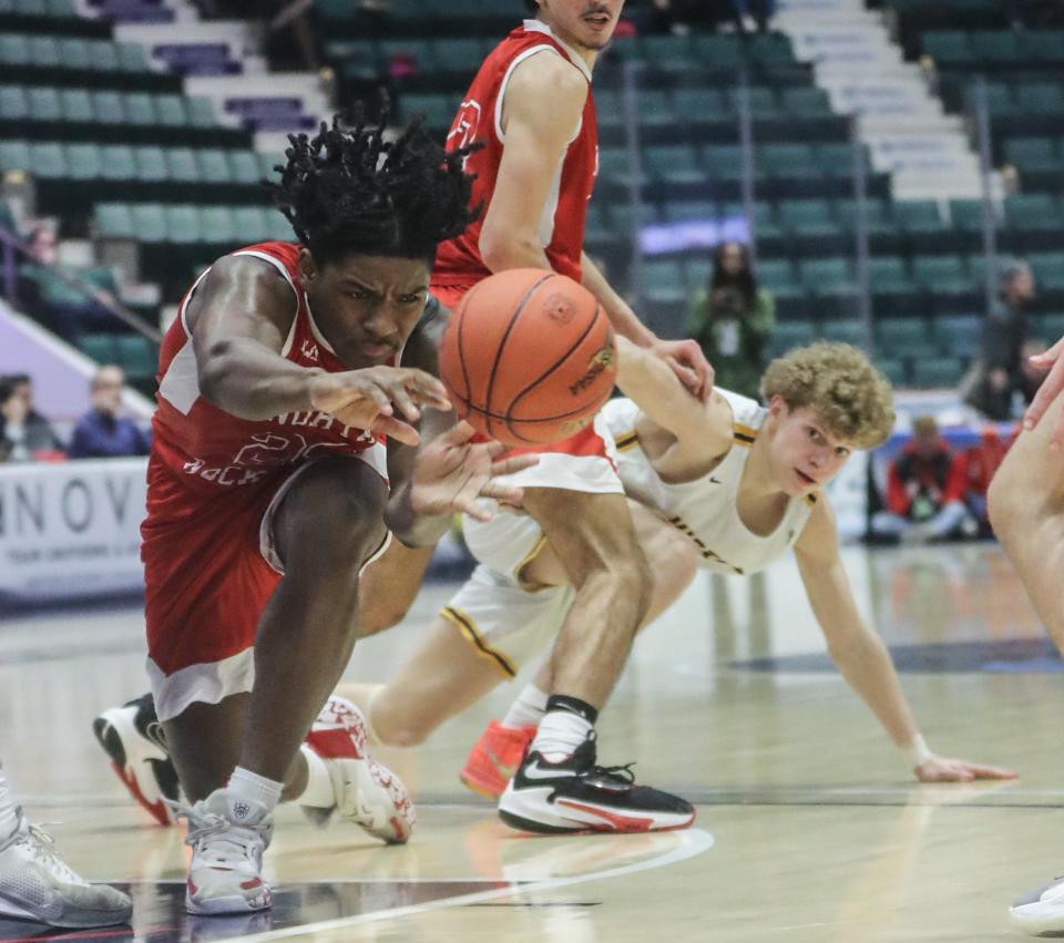 Elijah Barclay of North Rockland reaches for a loose ball against Victor during the NYSPHSAA Class AA basketball championship game at the Cool Insuring Arena in Glens Falls March 17, 2023. Victor defeated North Rockland 56-38.