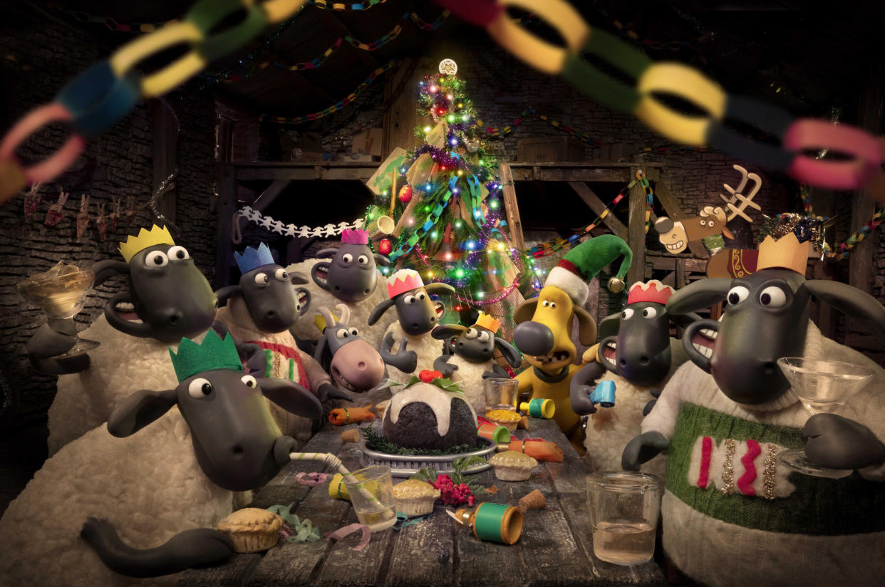 WARNING: Embargoed for publication until 00:00:01 on 23/11/2021 - Programme Name: Shaun the Sheep: The Flight Before Christmas - TX: n/a - Episode: Shaun the Sheep: A Winter's Tail (No. n/a) - Picture Shows: Shaun, Timmy, Bitzer and The Flock enjoying Christmas dinner.   - (C) Ardman Animations - Photographer: Ardman Animations