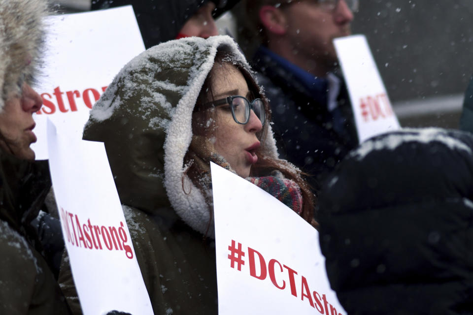 Denver teacher Rachel Davis protests outside the Colorado State Capitol on Wednesday, Feb. 6, 2019. Teachers said they plan to strike next week after state officials declined to intervene in a pay dispute between the educators and the school district. The Denver Classroom Teachers Association represents 5,635 educators in the school system. (AP Photo/Thomas Peipert)
