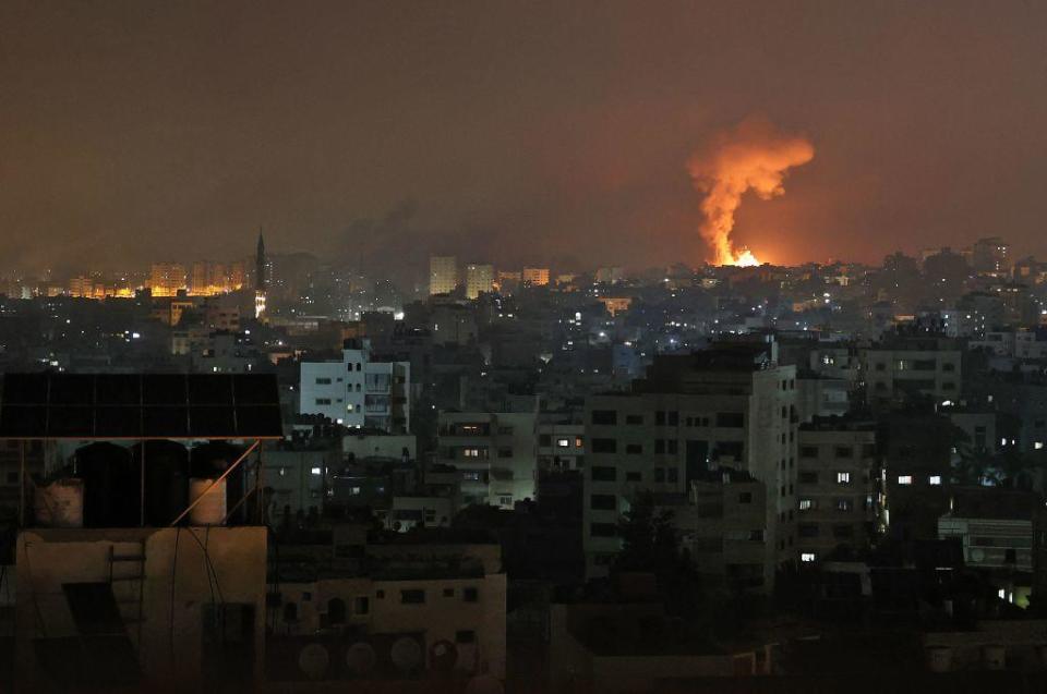 An explosion lights the sky following an Israeli airstrike on Beit Lahia in the northern Gaza Strip. / Credit: MOHAMMED ABED/AFP via Getty