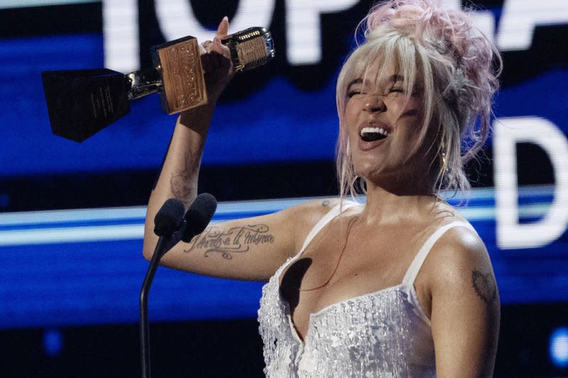 Karol G wins an award at the 2023 Latin Billboard Music Awards on October 5, 2023. File Photo by Gary I Rothstein/UPI