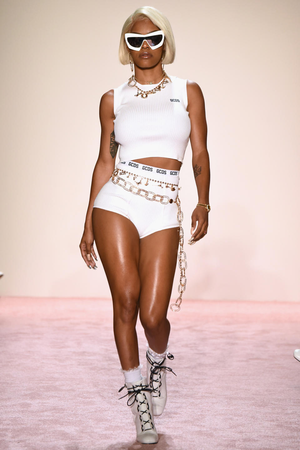 <p>Taylor strut her stuff at the GCDS fashion show in white separates.</p>