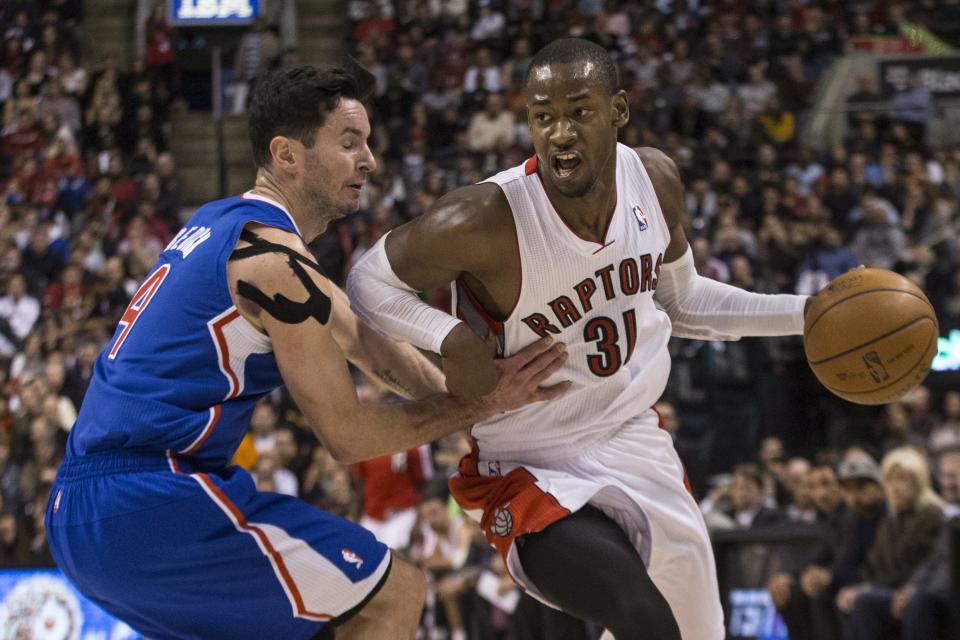 Toronto Raptors' Terrence Ross, (31) drives past Los Angeles Clippers' J.J. Redick during the second half of an NBA basketball game, Saturday, Jan. 25, 2014 in Toronto. (AP Photo/The Canadian Press, Chris Young)