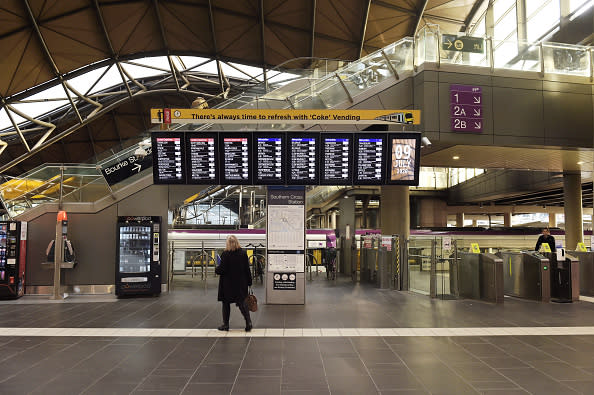 A commuter checks the departure board at a deserted Spencer Street Station in Melbourne.