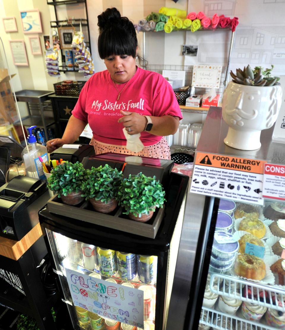 Angie Robles getting an early morning start at the cafe/bakery "My Sister's Fault" in Milford she owns with her sister Rous.