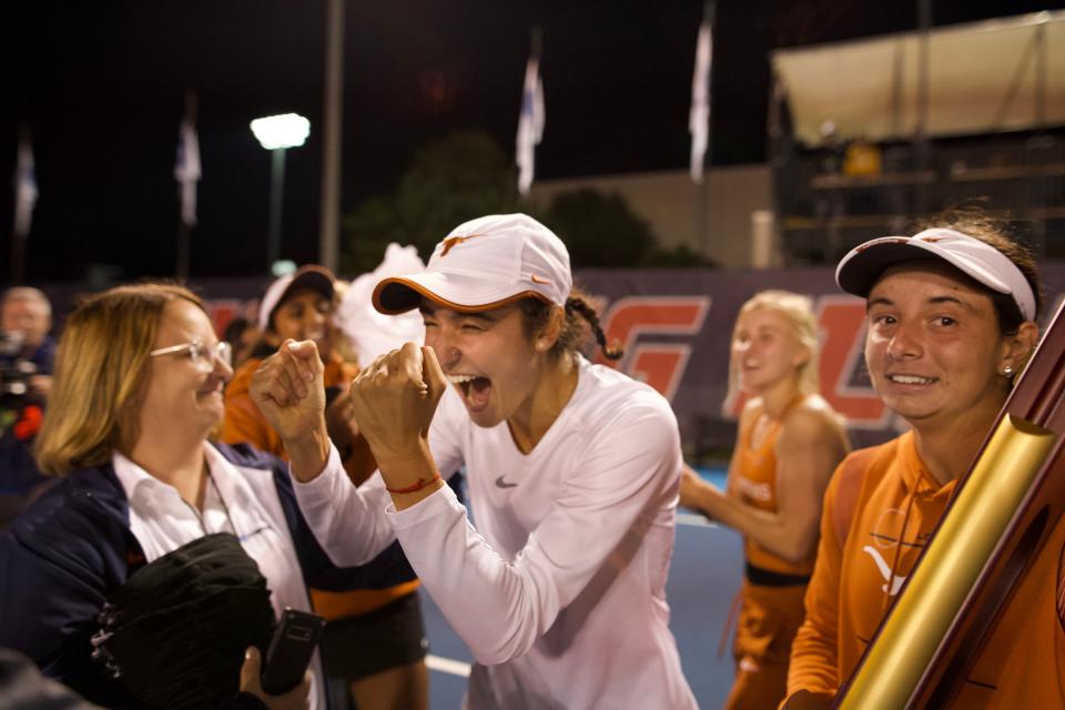 Texas freshman Sabina Zeynalova celebrates the Longhorns winning the NCAA national championship after her 6-3, 7-6 (7-4) win over OU’s Ivana Corley. Zeynalova competed this season while dealing with the Russian invasion of her home country Ukraine. She still has family in Ukraine.