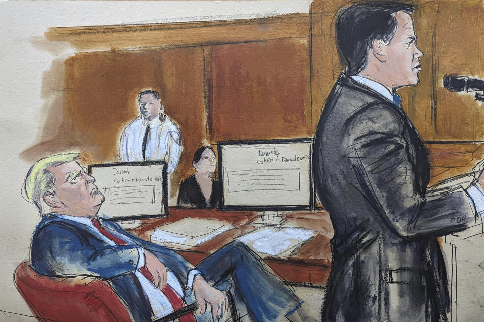 In this courtroom sketch, Tuesday, May 28, 2024, Donald Trump, seated left at the defense table, turns and looks at his attorney Todd Blanche during the defense summation, in New York. (Elizabeth Williams via AP)