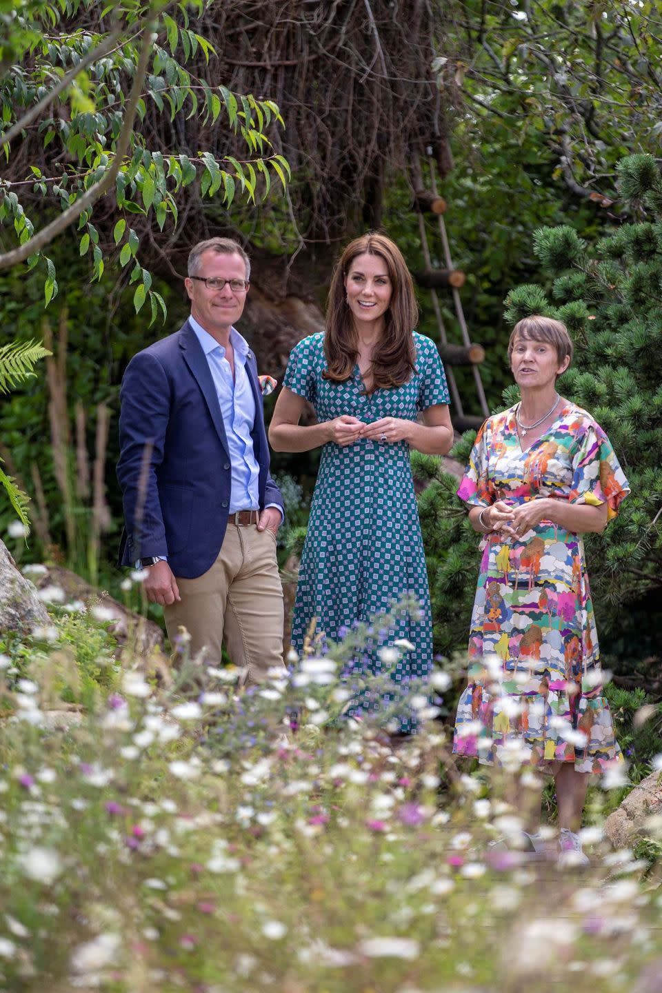 Duchess of Cambridge reacts as she visits her 'Back to Nature Garden' installed at Hampton Court Palace Garden Festival