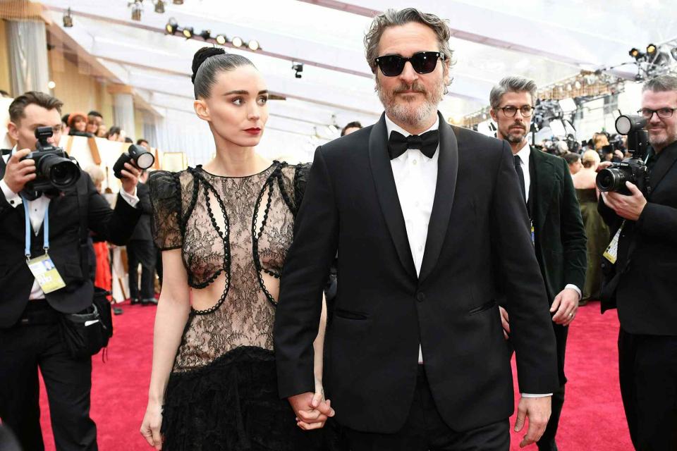 <p>VALERIE MACON/AFP via Getty </p> Rooney Mara, Joaquin Phoenix.