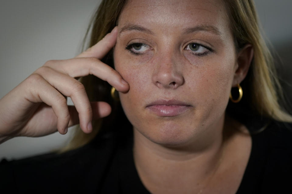 FILE - Shannon Keeler poses for a portrait in the United States on Wednesday, April 7, 2021. An American accused of sexually assaulting Keeler at a Pennsylvania college in 2013 and later sending her a Facebook message that said, “So I raped you,” has been detained in France after a three-year search. (AP Photo/Chris Carlson, File)