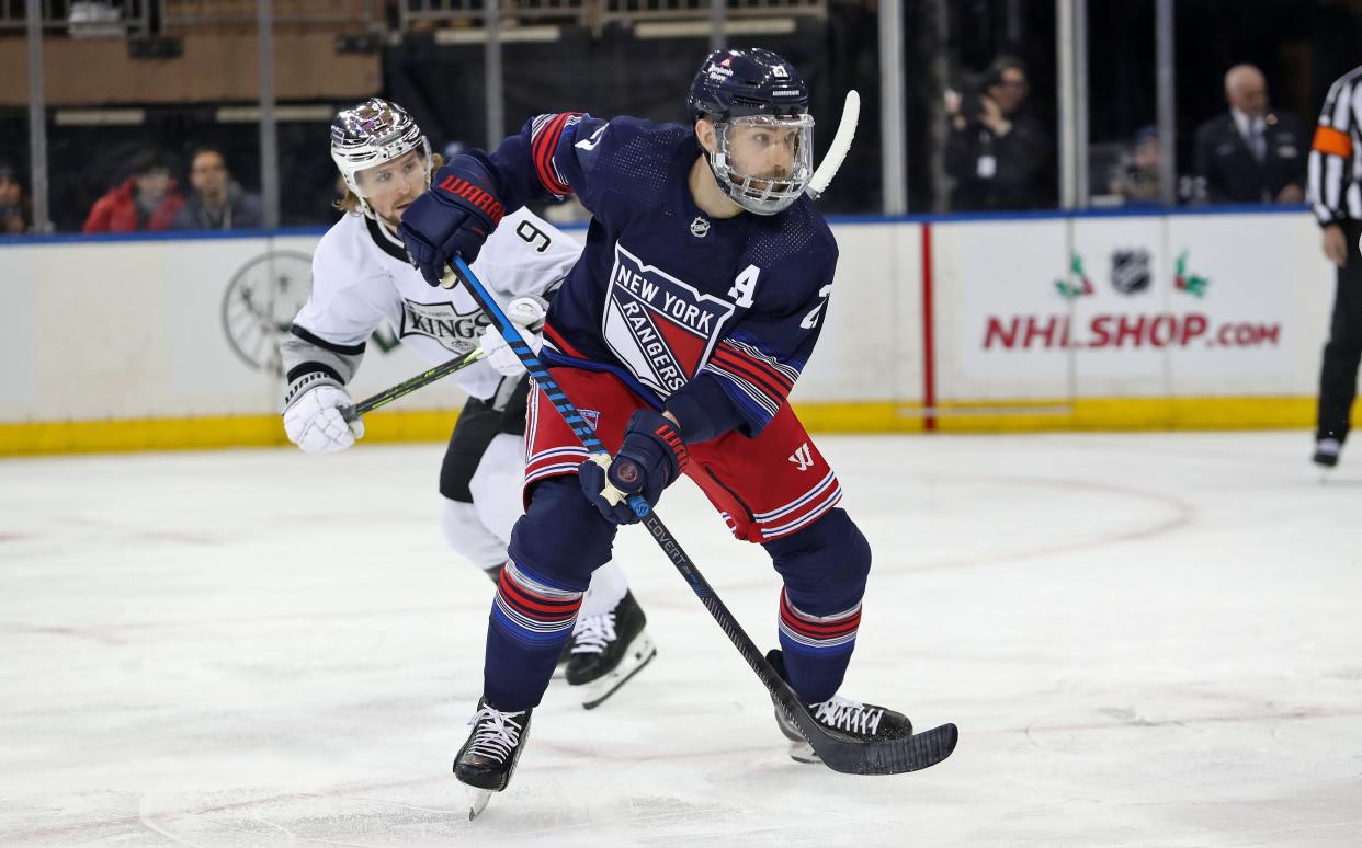 Dec 10, 2023; New York, New York, USA; New York Rangers center Barclay Goodrow (21) looks for the puck against the Los Angeles Kings during the first period at Madison Square Garden.