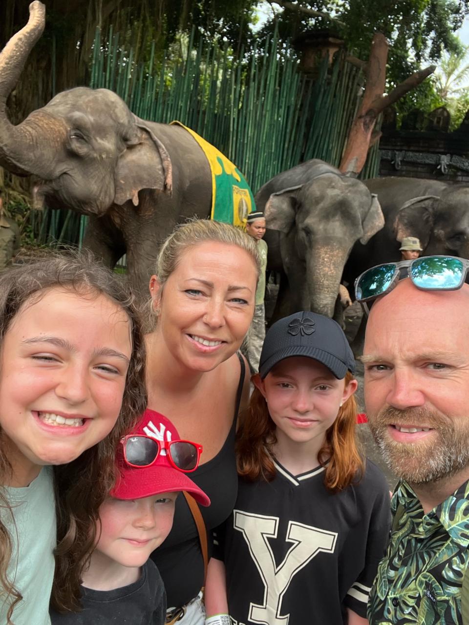 Carl, Ruth and kids Maisie, Pippa and Marley in Bali with elephants in March 2023. (SWNS)