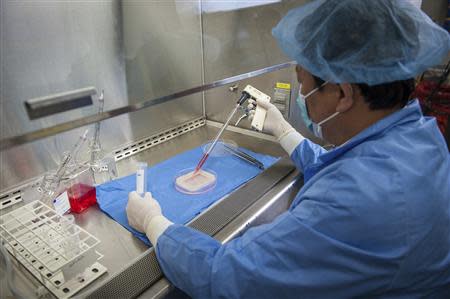 Yuanyuan Zhang, M.D., Ph.D, assistant professor at the Wake Forest Institute for Regenerative Medicine, demonstrates the process to engineer a vaginal organ in this undated handout photo from the Wake Forest Institute for Regenerative Medicine. REUTERS/Wake Forest Institute for Regenerative Medicine/Handout via Reuters