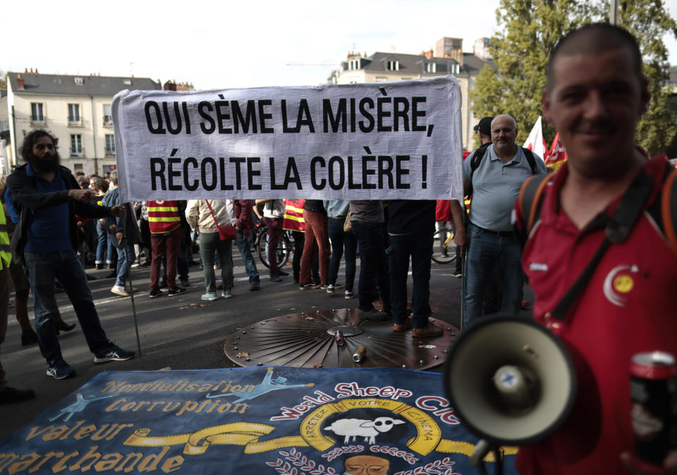 FILE - Protesters hold a banner that reads, "who sows misery reaps anger" during a demonstration, in Nantes, western France, Oct. 18, 2022. Across Europe, soaring inflation is behind a wave of protests and strikes that underscores growing discontent with spiralling living costs and threatens to unleash political turmoil. (AP Photo/Jeremias Gonzalez, file)