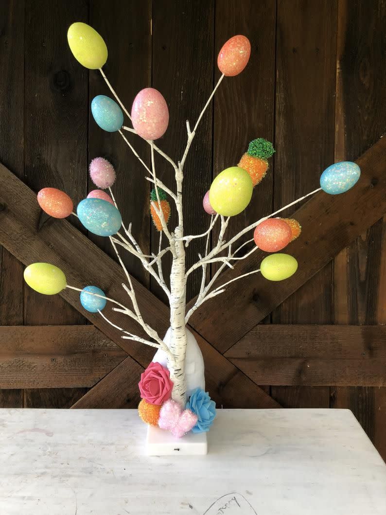 Stick the eggs on the ends of twigs