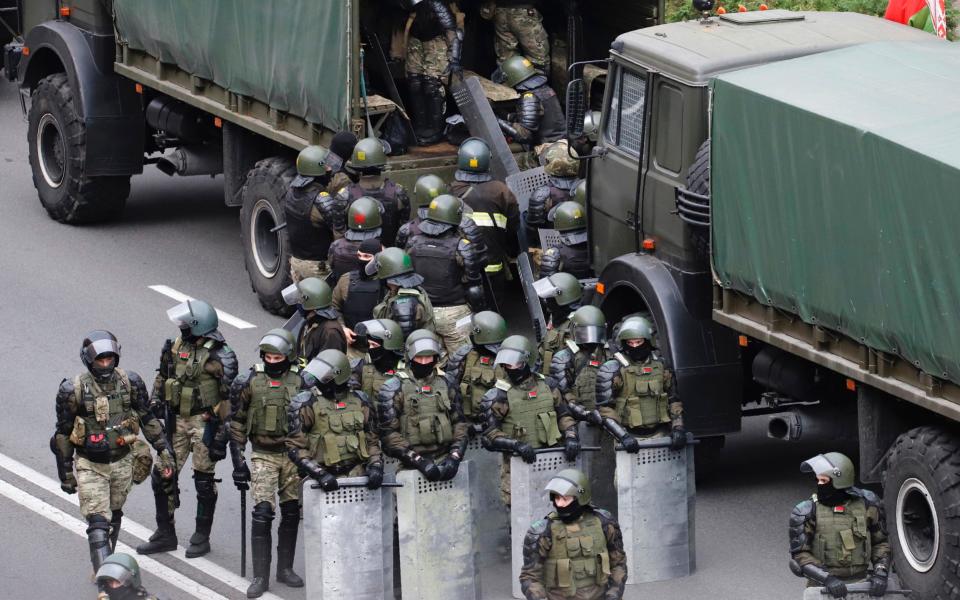 Belarusian riot police officers are generally well paid and have access to subsidised loans and housing - AP Photot