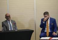 President of the National Assembly of Venezuela, Jorge Rodriguez, left, jokes with Nicolas Maduro Guerra, son of Venezuela's President Nicolas Maduro, after signing an agreement to create a U.N.-managed fund to finance health, food and education programs for the poor during a ceremony at a hotel in Mexico City, Saturday, Nov. 26, 2022. The agreement signed by representatives of Venezuelan President Nicolás Maduro and the opposition marked the resumption of long-stalled negotiations meant to find a common path out of their country's complex crisis. The U.S. government, in response, agreed to allow oil giant Chevron to pump Venezuelan oil. (AP Photo/Fernando Llano)