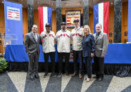 From left, Hall of Fame President Josh Rawitch, with newly elected Baseball Hall of Fame inductees Adrián Beltré, Todd Helton, and Joe Mauer, Chairman of the Board Jane Forbes Clark and BBWAA secretary-treasurer Jack O'Connel pose for a photograph during a news conference Thursday, Jan. 25, 2024, in Cooperstown, N.Y. (AP Photo/Hans Pennink)