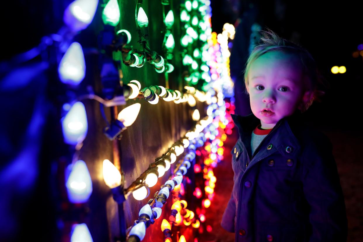 Trevor Green, 1, is dazzled by Christmas lights on display during Elf Night at Dorothy B. Oven Park on Thursday, Dec. 19, 2019. 