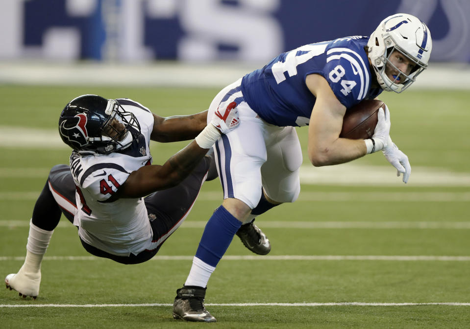 <p>Indianapolis Colts’ Jack Doyle (84) is tackled by Houston Texans’ Zach Cunningham (41) during the first half of an NFL football game, Sunday, Dec. 31, 2017, in Indianapolis. (AP Photo/Michael Conroy) </p>