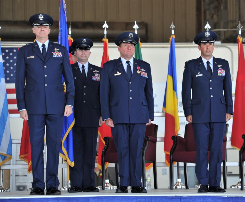 Major General Craig Wills 19th Air Force Commander (left), Colonel Robert F. Haas Outgoing Commander (middle) and Colonel Brad Orgeron Incoming Commander (right) stand at attention during the 80th Flying Training Wing Change of Command ceremony at Sheppard Air Force Base in Wichita Falls on Friday, June 24, 2022.