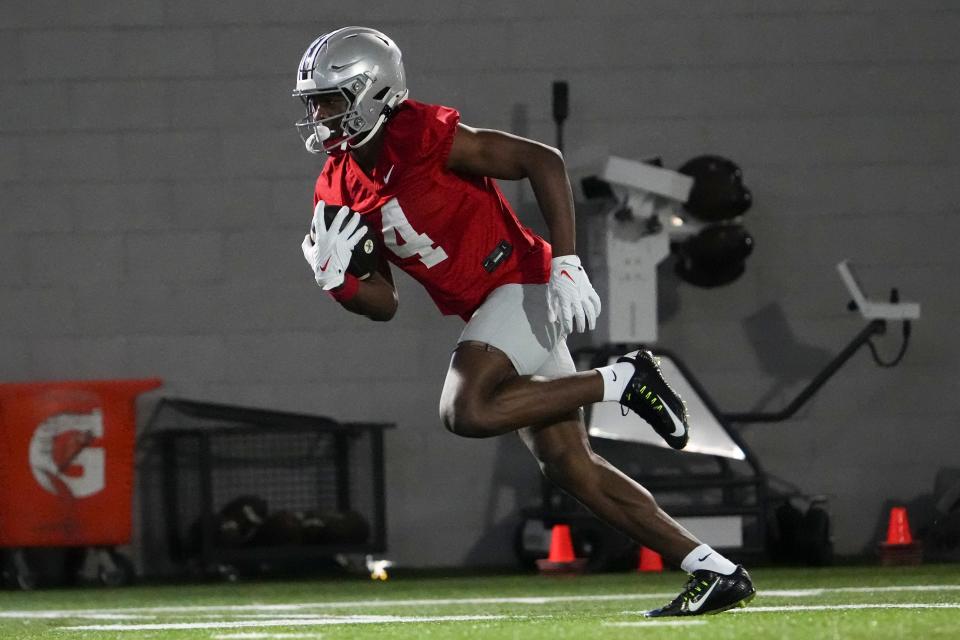 Mar 7, 2024; Columbus, OH, USA; Ohio State Buckeyes wide receiver Jeremiah Smith (4) catches a pass during spring football practice at the Woody Hayes Athletic Center.