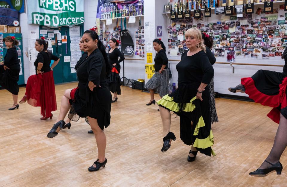 Flamenco dancer Gabriela Reyes, of West Palm Beach, leads a group of 10 women through footwork practice during an adult class teaching the art of flamenco dance at Royal Palm Beach High School on Feb. 9.