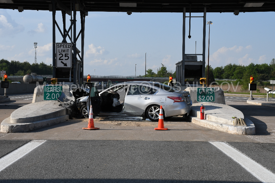 After the impact of a crash into a concrete barrier at the Hampton toll plaza on Interstate 95 northbound, a Nissan Altima came to rest perpendicular to the interstate between two concrete barriers Thursday, May 23, 2024.