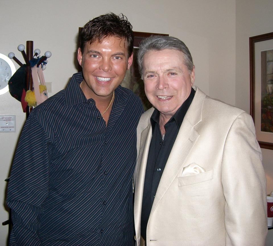 Mike Patrick smiles alongside Mickey Gilley.