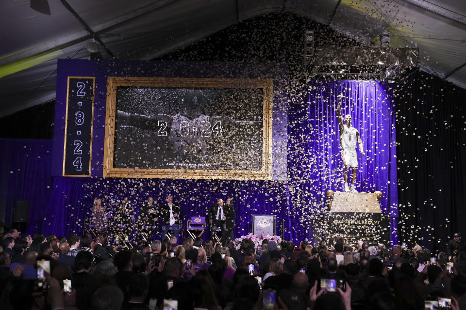 Confetti is released during unveiling of a statue of former Los Angeles Lakers guard Kobe Bryant outside the NBA basketball team's arena, Thursday, Feb. 8, 2024, in Los Angeles. (AP Photo/Eric Thayer)