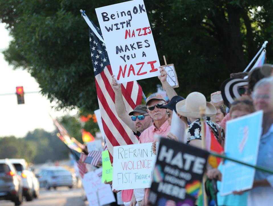 Hundreds rally in a show of support against hate Saturday, July 23, 2022, on Route 1 in Kittery, a week after a neo-Nazi group appeared in the same area.