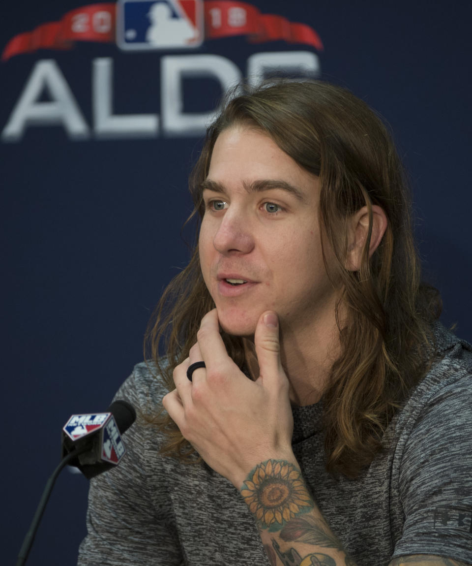 Cleveland Indians starting pitcher Mike Clevinger answers a question during a news conference before a workout in Cleveland, Sunday, Oct. 7, 2018. Clevinger will start the third game of the ALDS series against the Houston Astros, Monday. (AP Photo/Phil Long)