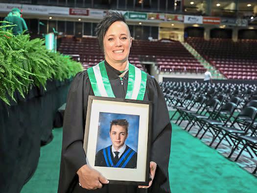 Danita carried a photo of Ben at graduation