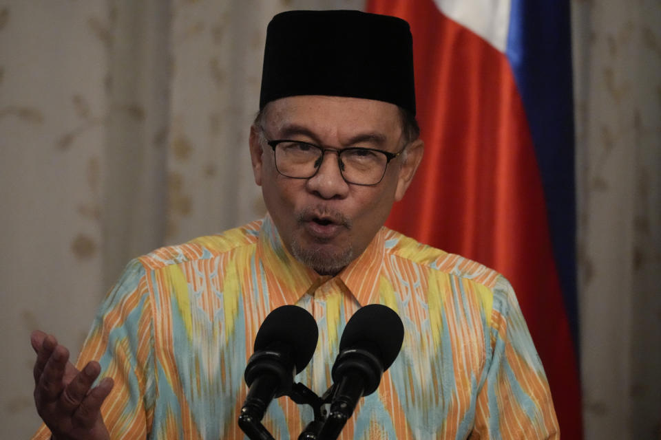 Malaysia's Prime Minister Anwar Ibrahim gestures as he delivers his speech during his visit at the Malacanang presidential palace in Manila, Philippines on Wednesday Mar. 1, 2023. (AP Photo/Aaron Favila, Pool)