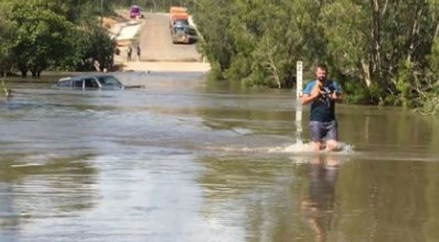 Senior Constable Ben Lloyd waded in to save them just in time. Photo: Queensland Police