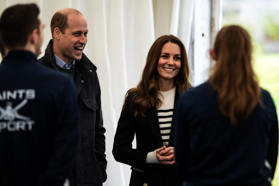 Britain's Catherine, Duchess of Cambridge and Britain's Prince William, Duke of Cambridge meet students as they visit the University of St Andrews in St Andrews on May 26, 2021. (Photo by Andy Buchanan / POOL / AFP) (Photo by ANDY BUCHANAN/POOL/AFP via Getty Images) ORG XMIT: 0 ORIG FILE ID: AFP_9AT367.jpg