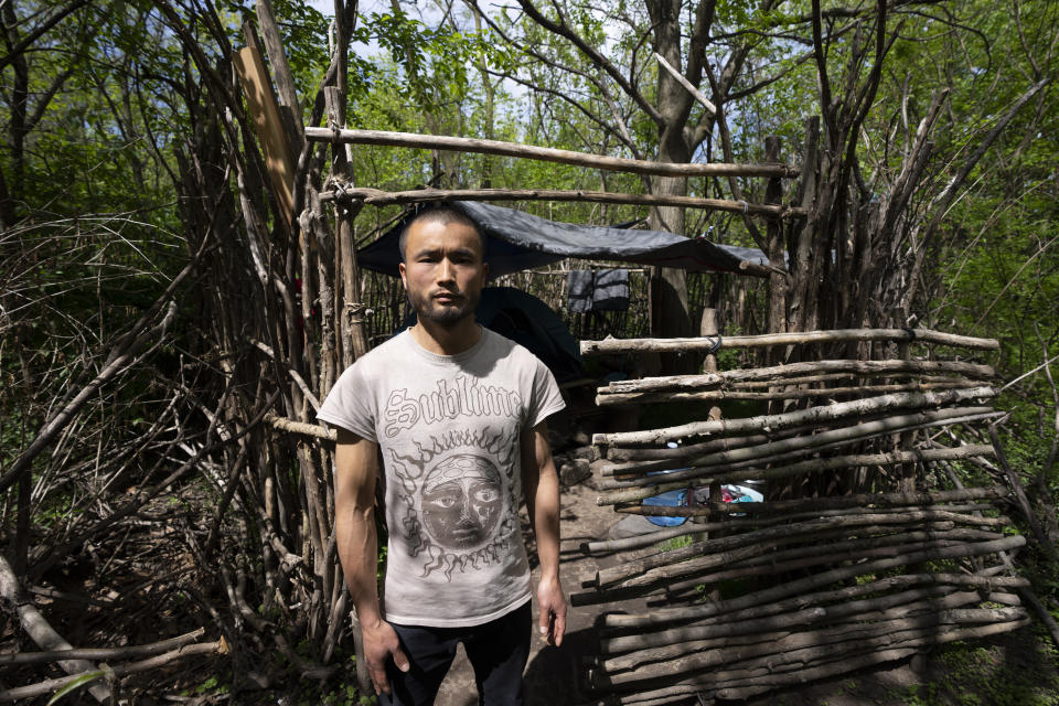 Chen Wang, a Chinese migrant currently homeless in New York, poses for a photo near his tent on Friday, May 3, 2024. Chen came to the U.S. after getting criminally admonished by Chinese police for anti-Chinese Communist Party posts on X, formerly known as Twitter. The daily struggle to find work for Chinese immigrants living illegally in New York is a far cry from the picture Donald Trump and other Republicans have sought to paint about them. Asian advocacy organizations say they're concerned the exaggerated rhetoric could fuel further harassment against Asians in the U.S. (AP Photo/Serkan Gurbuz)