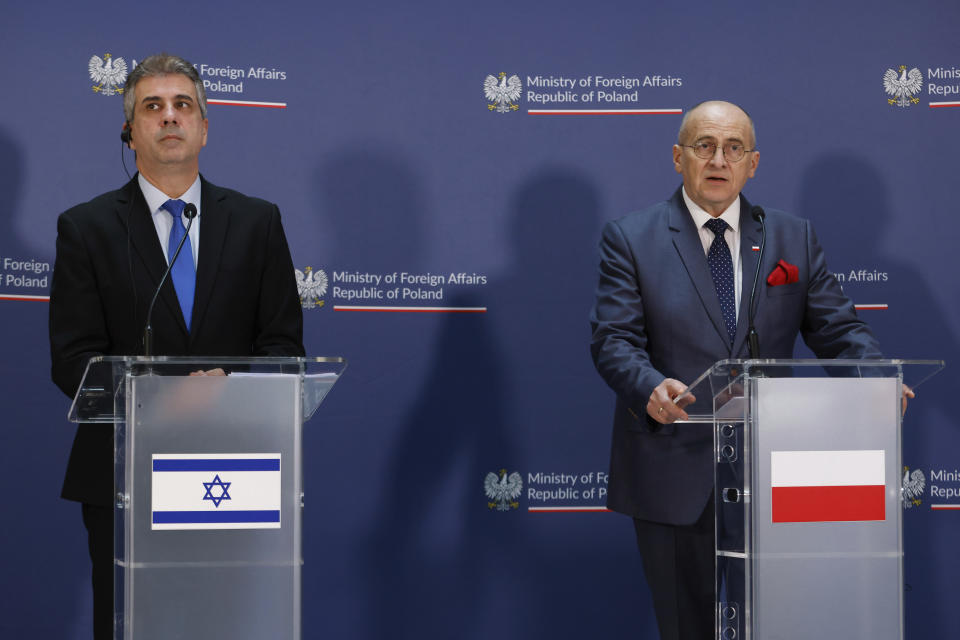 Poland's Minister of Foreign Affairs Zbigniew Rau, right, and his Israeli counterpart Eli Cohen, left, attend a joint press conference in Warsaw, Poland, Wednesday, March 22, 2023. (AP Photo/Michal Dyjuk)