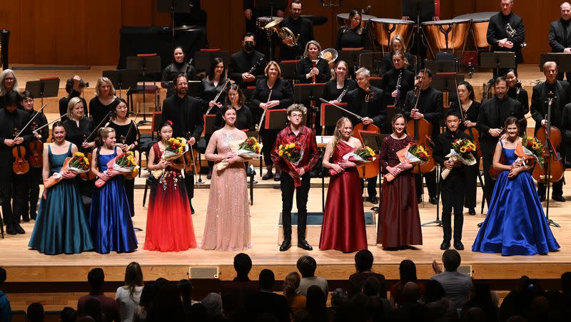 Alina Baron, Whitney Baron, Deann Huang, Anne Turner, Ezekiel Sokoloff, Sarah Kendell, Sophie Wilkes, Alvin Gao and Maya Marsh all take the stage following the Salute to Youth concert at Abravanel Hall in Salt Lake City on Wednesday, Nov. 22, 2023.