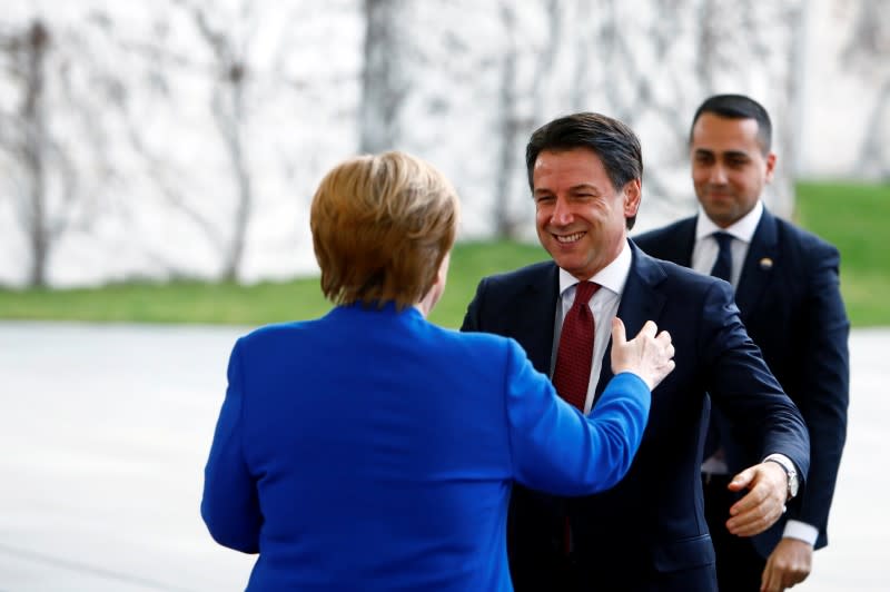 German Chancellor Angela Merkel welcomes Italian Prime Minister Giuseppe Conte and Italian Foreign Minister Luigi Di Maio at the Libya summit in Berlin