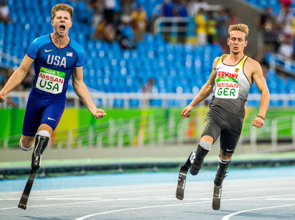 Germany's Johannes Floores (R) and USA's Hunter Woodhall (L) react after the Final Men's 4x100m Relay - T42-47 - during the Rio 2016 Paralympic Games, Rio de Janeiro, Brazil, 12 September 2016. / Credit: Jens Büttner/picture alliance via Getty Images